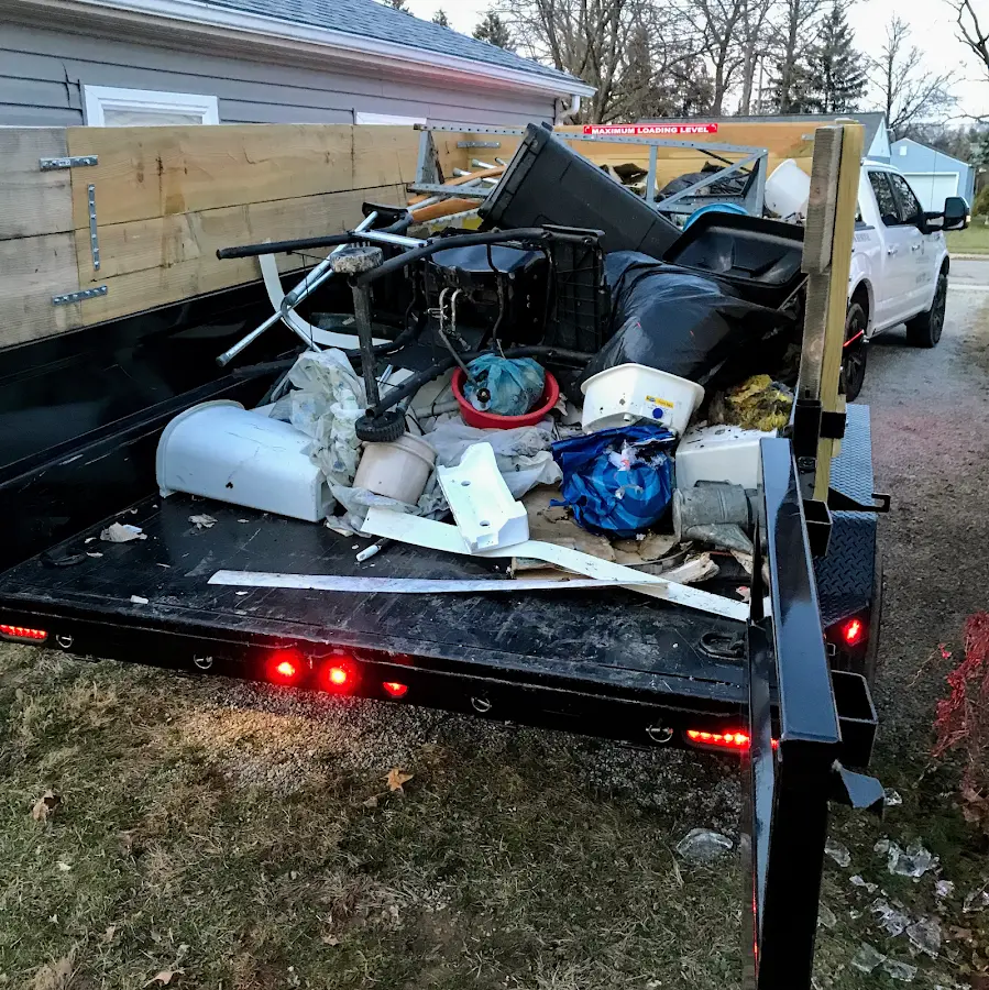 Roll-off dumpster delivered to a residential driveway in Sennett