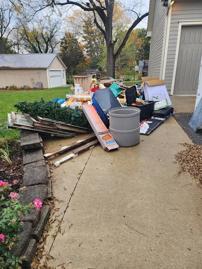 Dumpster being loaded with debris for 3 Yard Dumpster Rental in Sennett